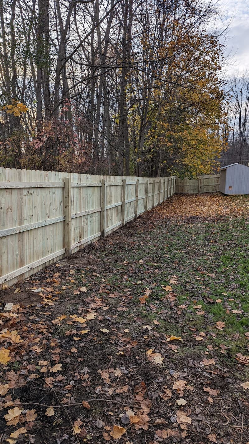 Custom wood privacy fence installation in Farmington, NY